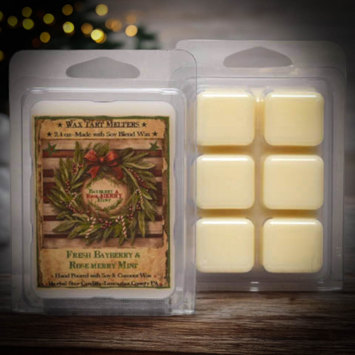 Clear packaging of wax melts with artwork featuring a wreath and some text