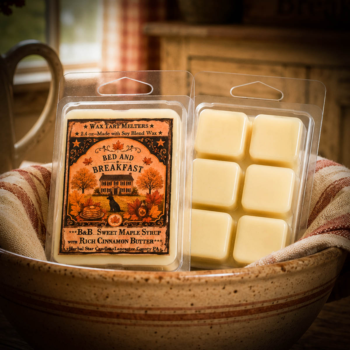 Wax tart melts packaging with a scenic label in a ceramic bowl.