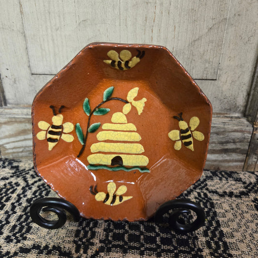 Octagonal redware plate with bee skep and flower motif
