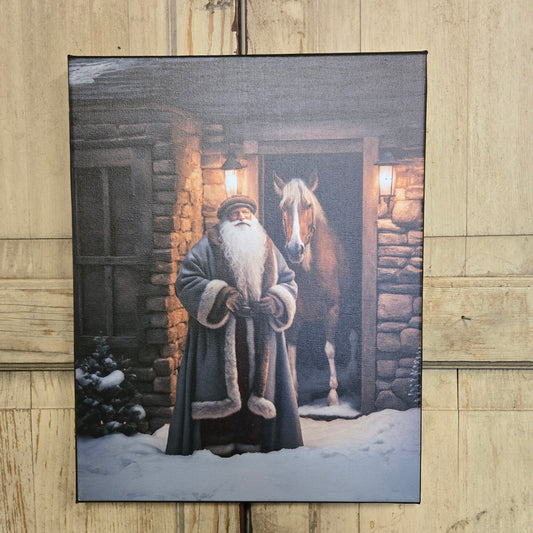 Framed artwork of a person in a robe with a dog on a wooden floor.