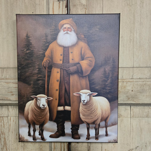 Framed artwork of a man with sheep on a wooden floor