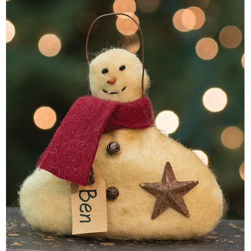 Snowman ornament wearing red scarf and rusty star