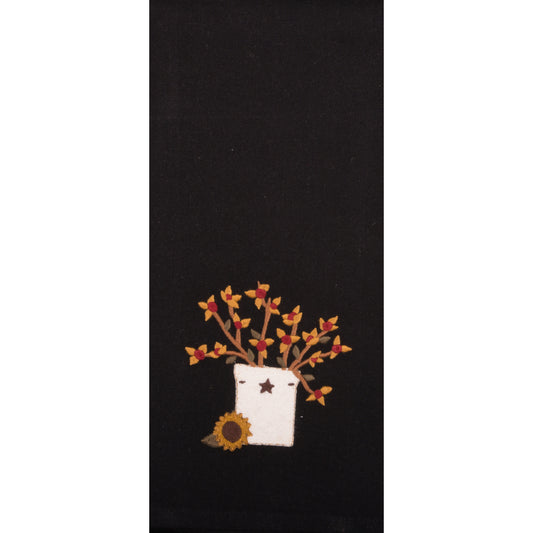 Hand towel with a crock holding bittersweet with sunflower beside it