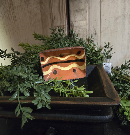 Small rectangular slipware with brown, yellow and black glazing