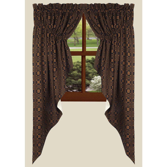 Brown patterned curtains with a window in the background
