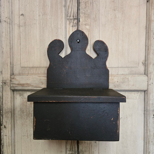 Black wood box on rustic wood background
