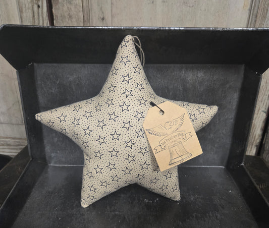 Star-shaped decorative item with a tag on a dark surface
