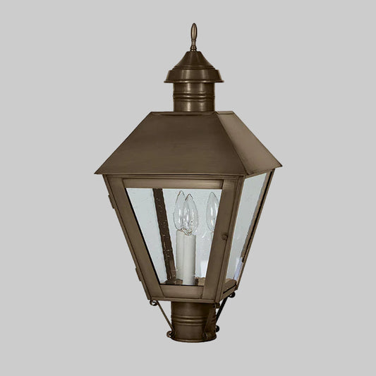 Bronze outdoor lamp with clear glass on a white background