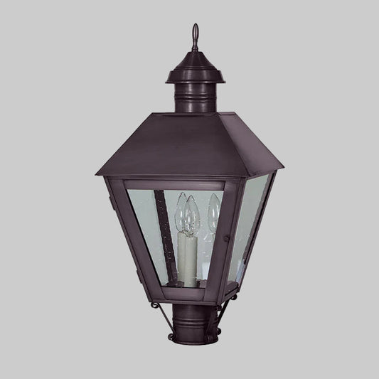 Bronze outdoor lantern with clear glass on a white background