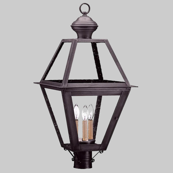 Decorative outdoor lantern with clear glass on a gray background