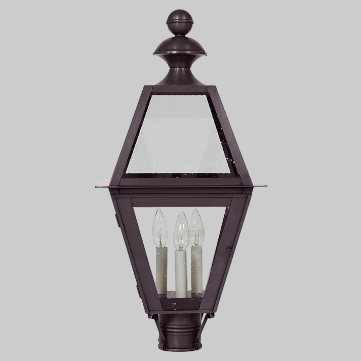 Traditional outdoor lamp with glass panels on a gray background