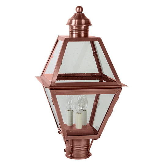 Copper outdoor lamp with clear glass on a white background