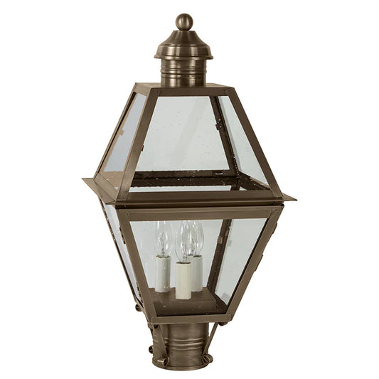 Bronze outdoor lamp with clear glass on a white background