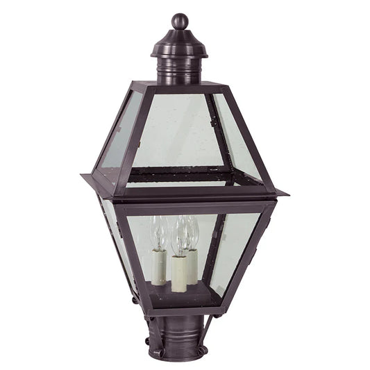 Traditional outdoor lamp with clear glass panels on a white background