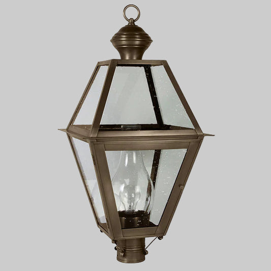 Bronze outdoor lamp with clear glass on a gray background