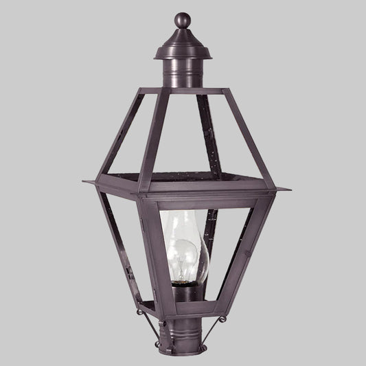 Decorative outdoor lamp with clear glass panels on a white background
