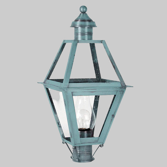 Vintage-style outdoor lamp with clear glass panels on a white background