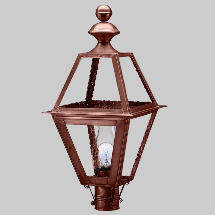 Copper outdoor lamp with clear glass on a gray background