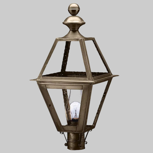 Decorative outdoor lamp with metallic finish on a gray background