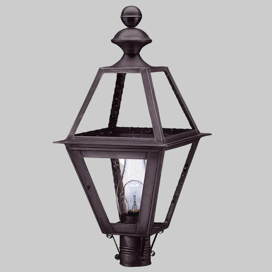 Decorative outdoor lamp with a black finish on a gray background
