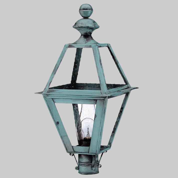 Vintage-style outdoor lamp with a metallic finish on a gray background