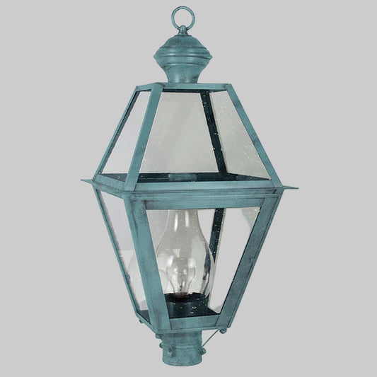 Vintage-style outdoor lamp with clear glass shade on a gray background