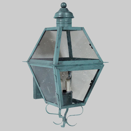 Hexagonal outdoor wall light fixture on a gray background