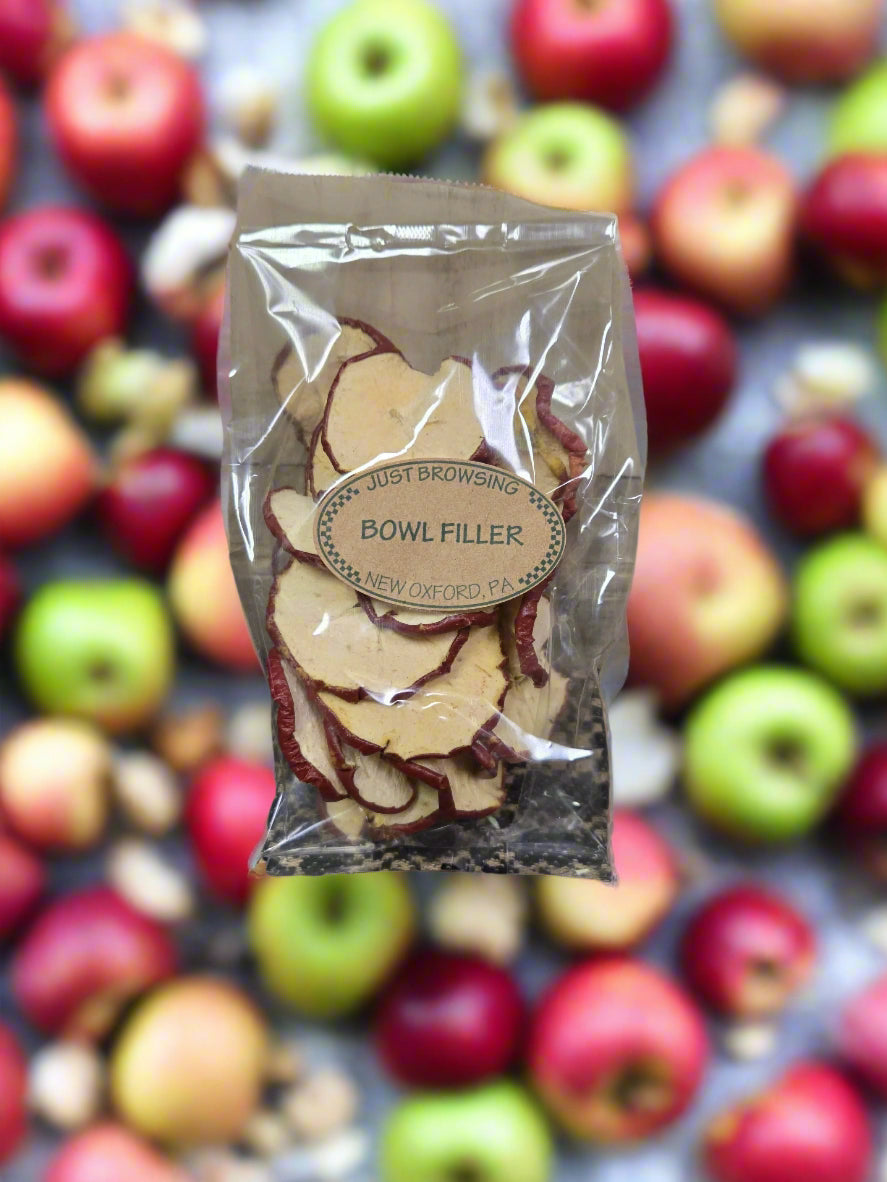 A clear plastic bag filled with center-cut apple slices, with the label 'BOWL FILLER - APPLE Slices' on the front.