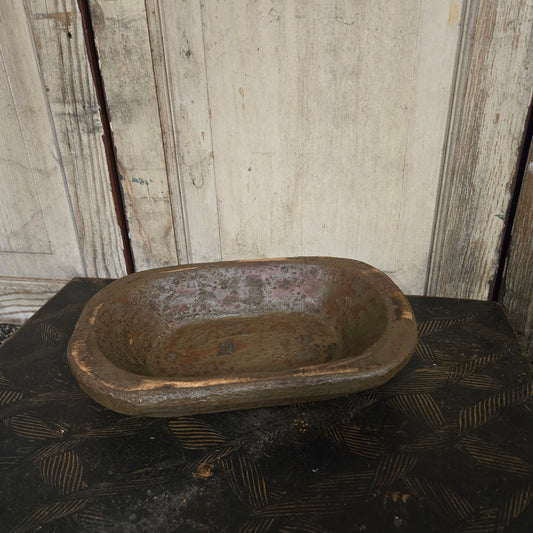 Rustic wood bowl on a wooden surface