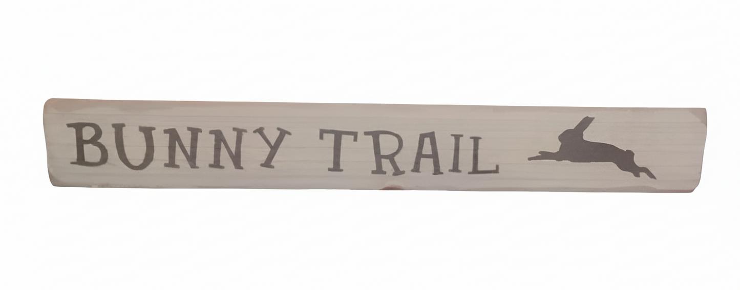 Wooden sign with 'Bunny Trail' text and rabbit silhouette on a cream background