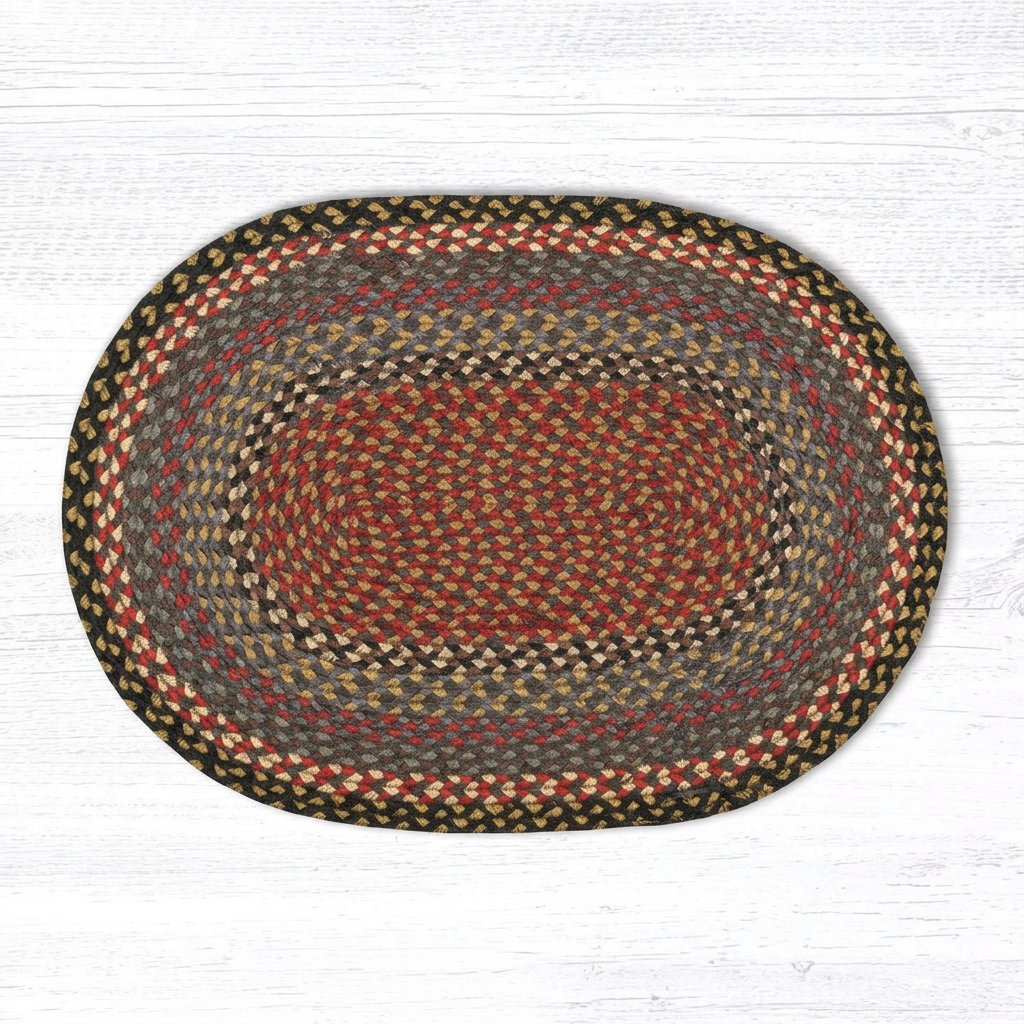 Burgundy, blue and gray oval braided rug shown horizontally on a white wood background.