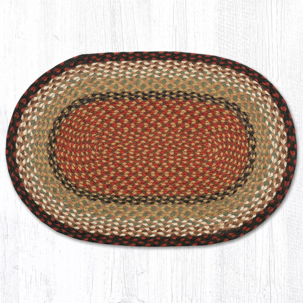 Burgundy and mustard oval braided rug with concentric multicolored bands on a white wood background.
