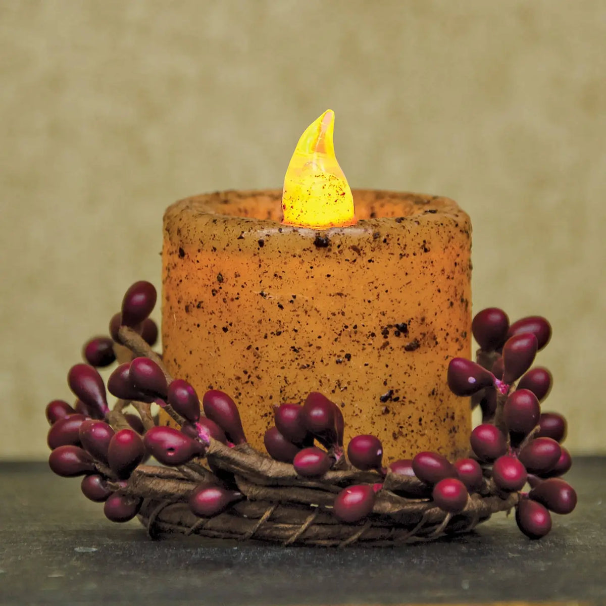 Decorative candle with a wick on a textured surface