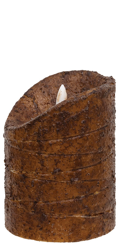 Cylindrical candle with a textured brown bark-like exterior on a white background
