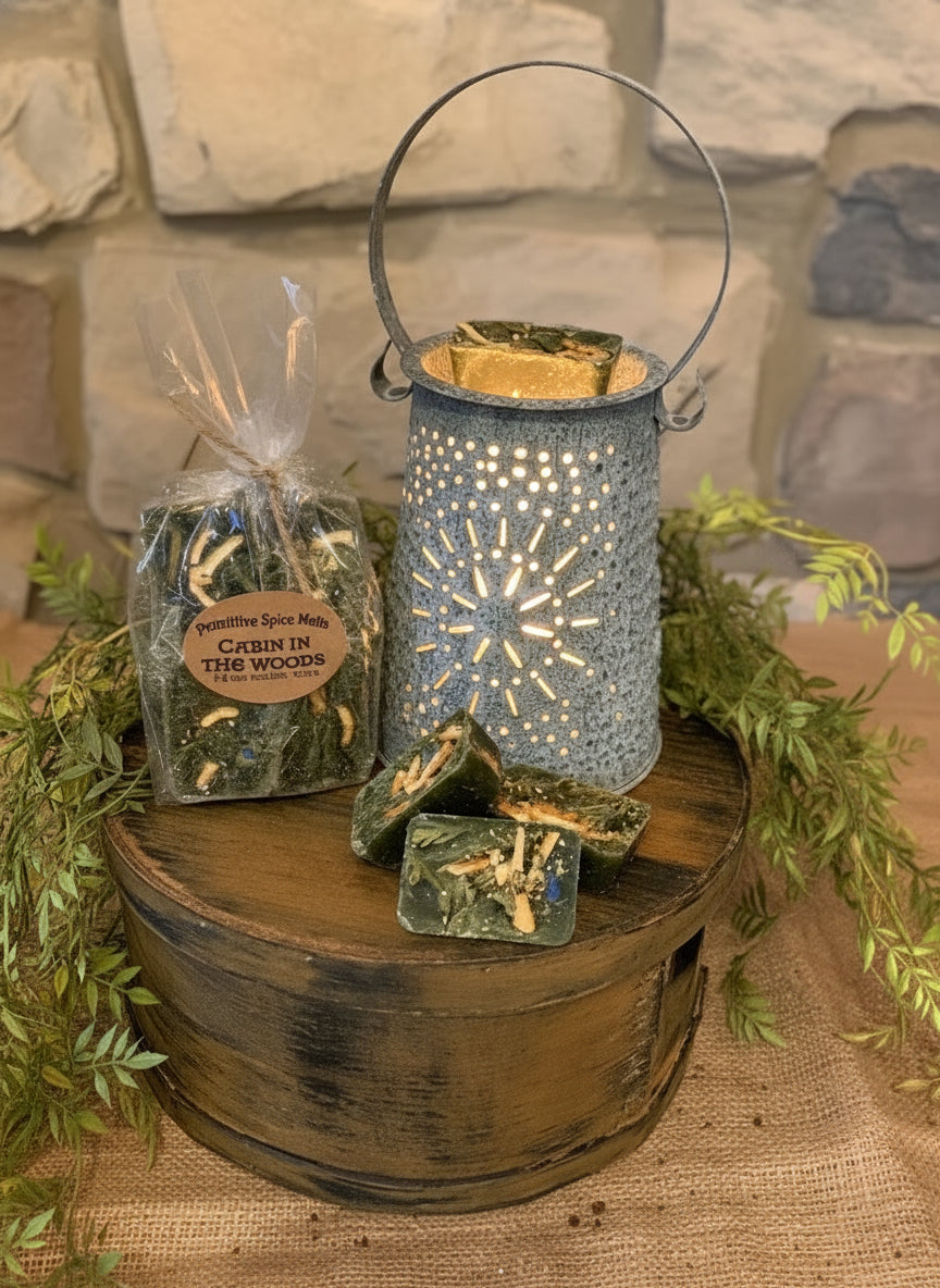 Decorative lantern with greenery on a wooden barrel against a stone wall.