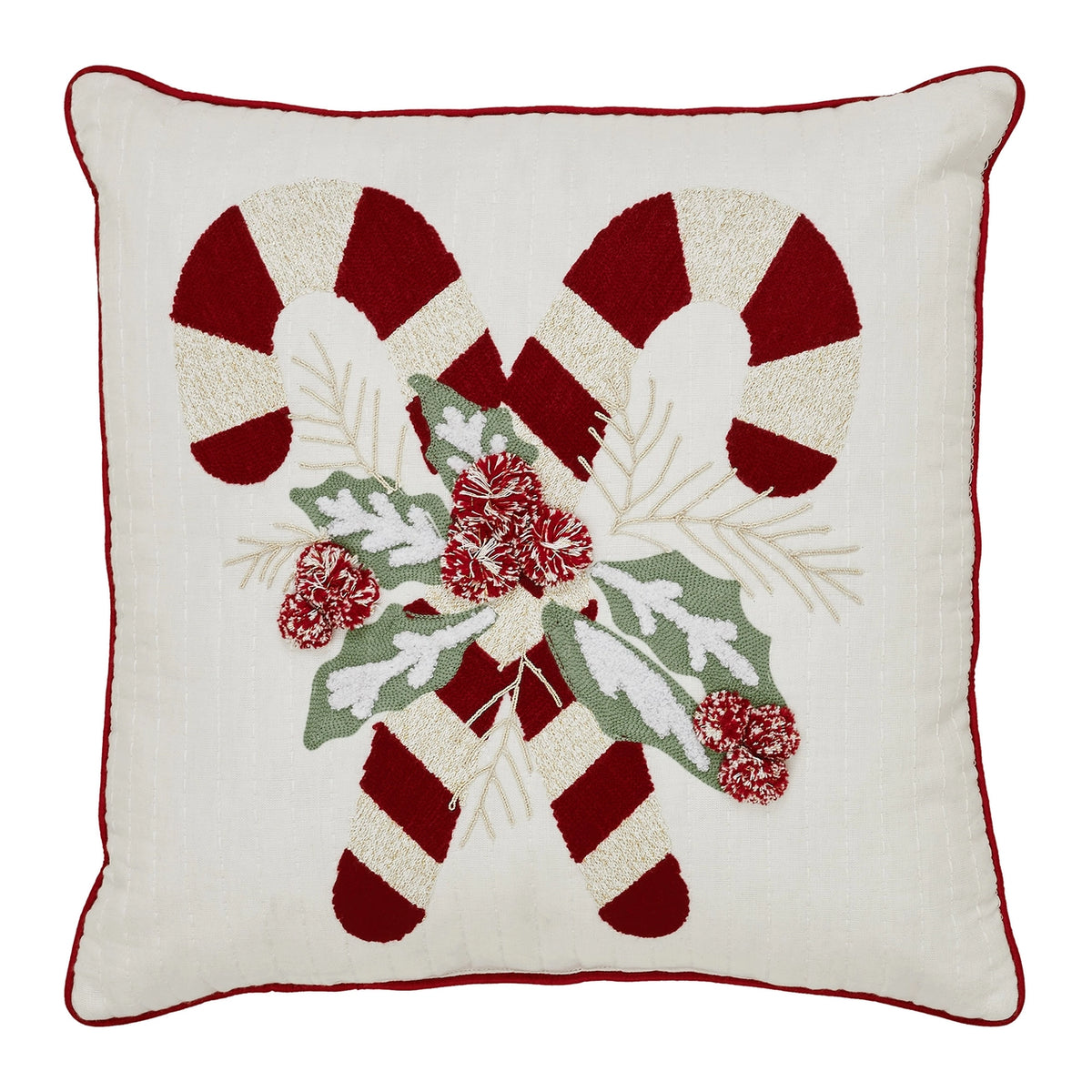 Front view of cream Christmas pillow with crossed red-and-white candy canes, textured holly leaves, red berries and red piping.