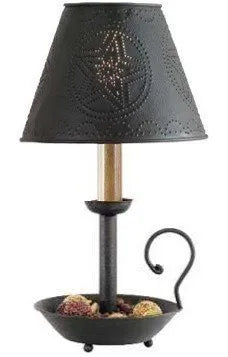 Decorative lamp with black shade and base on a white background