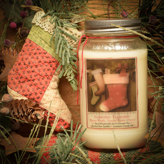 A 24 oz Mason jar candle with a Christmas theme, sitting amidst holiday decorations. The label on the jar depicts a red stocking and Christmas elements, and the candle appears to be unlit.