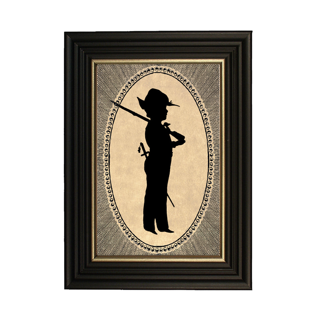 A framed silhouette illustration of a colonial boy with a rifle, printed on satin photo paper, set in a black wood frame with gold trim.