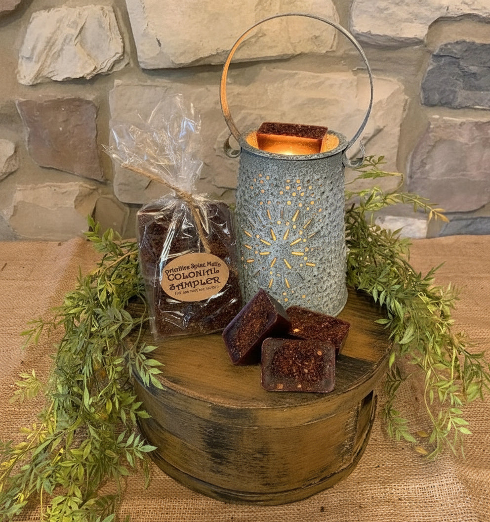 Candle holder with brown squares and a bag on a wooden surface with a stone wall background