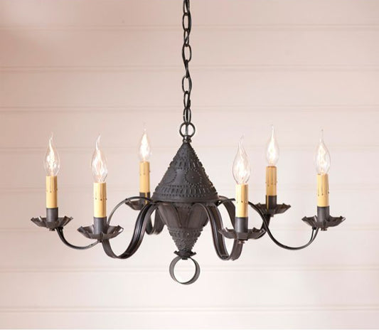 Black tin punched chandelier with six candle-style lights on a beige background