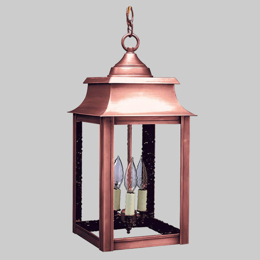 Copper lantern with glass shades on a white background