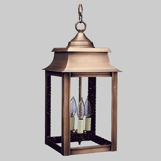Bronze outdoor lantern with three candle-like lights on a white background