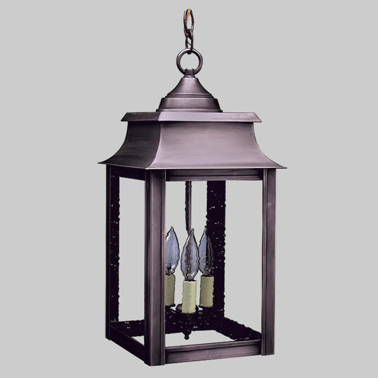 Decorative outdoor lantern with three candle-like lights on a white background