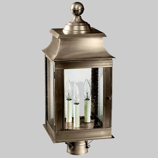 Decorative outdoor lantern with glass panels on a white background