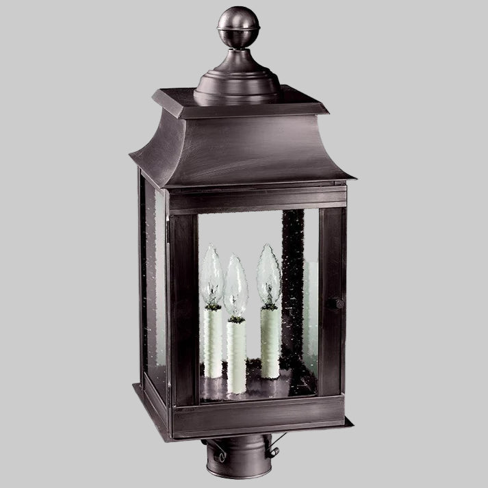 Decorative outdoor lantern with glass panels on a white background