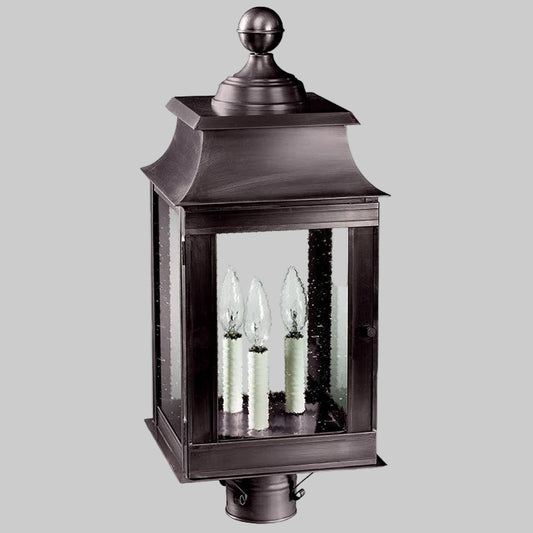 Decorative outdoor lantern with glass panels on a white background