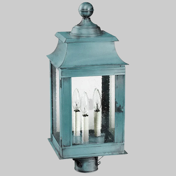 Teal outdoor lantern with clear glass on a white background
