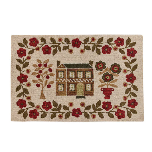 Decorative mat with a house and floral design on a beige background