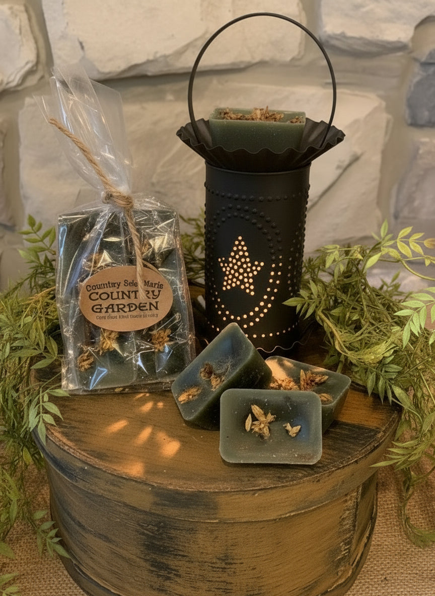 Decorative setup with a lantern, wax, and greenery on a stone surface